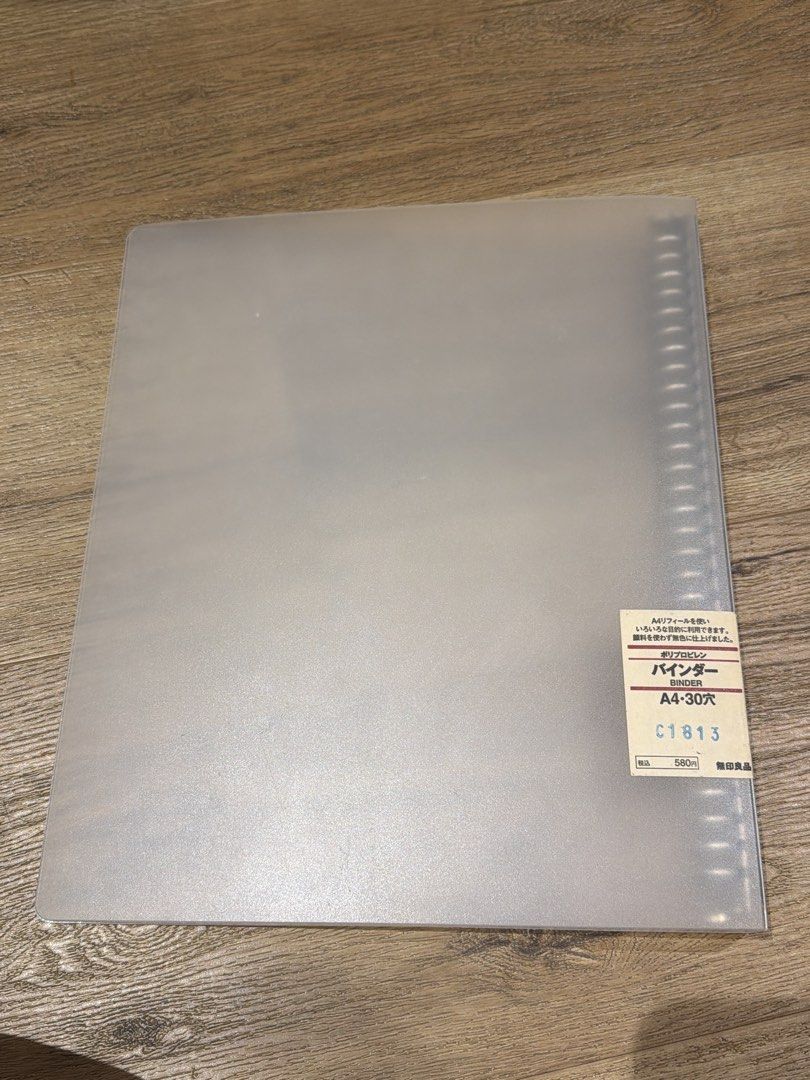 MUJI Loose Leaf Binder A4 30-Ring (Category: Stationery & School Supplies) located in Paranaque City. Submitted by nachoaveragegirl (Listing ID 1466915721, Image 1). Description: MUJI polypropylene binder in A4 size with 30 metal rings. Clear translucent cover. Standard notebook ring mechanism inside. Original product sticker attached on the front and back. Unused condition with store tag intact. Rfs decluttering.