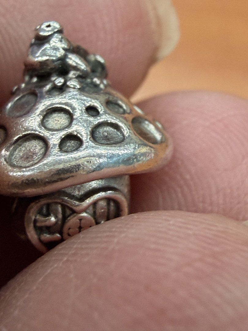 Mushroom house charm with frog silver bead (Category: Charms) located in Quezon City. Submitted by ellamenopi (Listing ID 1466775966, Image 3). Description: - Silver toadstool mushroom charm - Adorable little frog sitting on the cap - Heart-shaped door with carved window details - Standard core opening fits European charm bracelets.