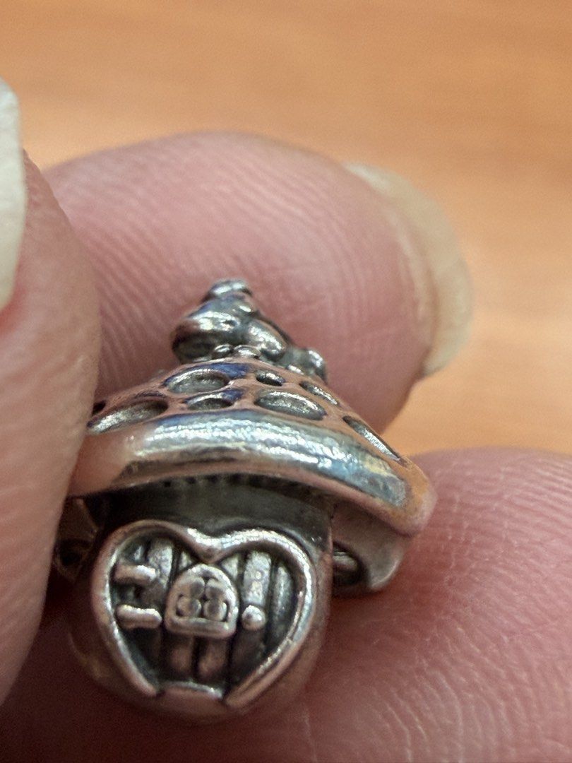 Mushroom house charm with frog silver bead (Category: Charms) located in Quezon City. Submitted by ellamenopi (Listing ID 1466775966, Image 2). Description: - Silver toadstool mushroom charm - Adorable little frog sitting on the cap - Heart-shaped door with carved window details - Standard core opening fits European charm bracelets.