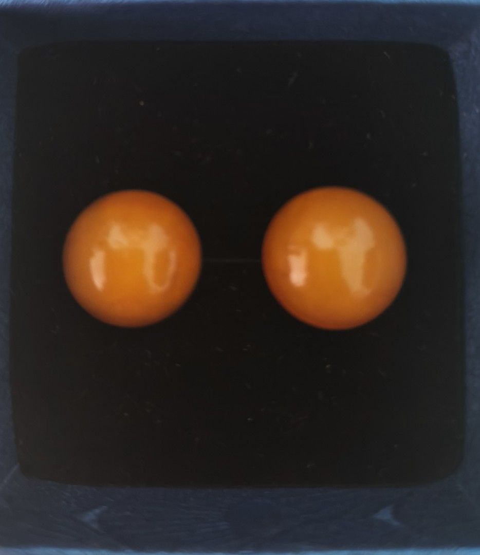 Natural Amber stud earrings in gold settings (Category: Earrings) located in Batangas. Submitted by decluttering_bliss (Listing ID 1466774870, Image 1). Description: - Color: Vibrant bright orange - Shape: Round stud earrings - Finish: Smooth and glossy - Style: Classic, minimal, and eye-catching - Packaging: Comes in a dark velvet jewelry box - Perfect as an everyday accessory or a thoughtful gift.
