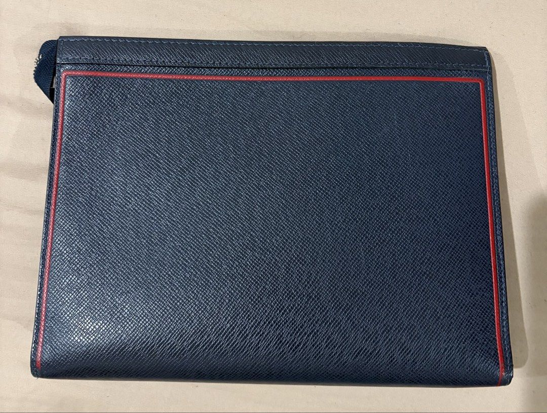 Navy Blue Document Folder with Red Trim (Category: Luxury Bags & Wallets) located in Taguig. Submitted by JBT1968 (Listing ID 1466924204, Image 1). Description: ✅ Authentic | Made in France ✅ Material: Navy Blue Taiga leather with red piping ✅ Silver-tone LV zipper pull ✅ Fits documents, passport, tablet, or small laptop ✅ Clean interior & exterior — minimal signs of use ✅ Date code: [fill in your code] ✅ Includes: Item only.