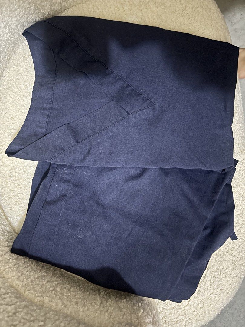 Navy Blue Scrub Top and Pants Set Small (Category: Sets or Coordinates) located in Cabuyao City. Submitted by viaaino (Listing ID 1466835549, Image 1). Description: - Color: Deep navy blue - Set includes: V-neck top and matching pants - Waistband: Elastic with adjustable drawstring - Condition: Clean fabric with minor fold lines from storage - Ideal for: Healthcare workers, nurses, dental staff, and medical students - Comfortable and practical fo