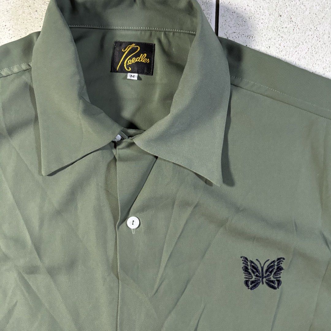 NEEDLES JP Bowling Button-Down Polo in Green (Category: Formal Shirts) located in Manila. Submitted by yama_archive (Listing ID 1466907857, Image 3). Description: NEEDLES JP Bowling Button-Down Polo in Green Dimes (inches starting from 0) — - Size on tag: M - Width: 23 - Length: 27 - Shoulders: 17 - Sleeves: 9.5 - Fabric: Rayon ₱1900 Issues: ❌ Condition: 10/10 Color Rate: 10/10.