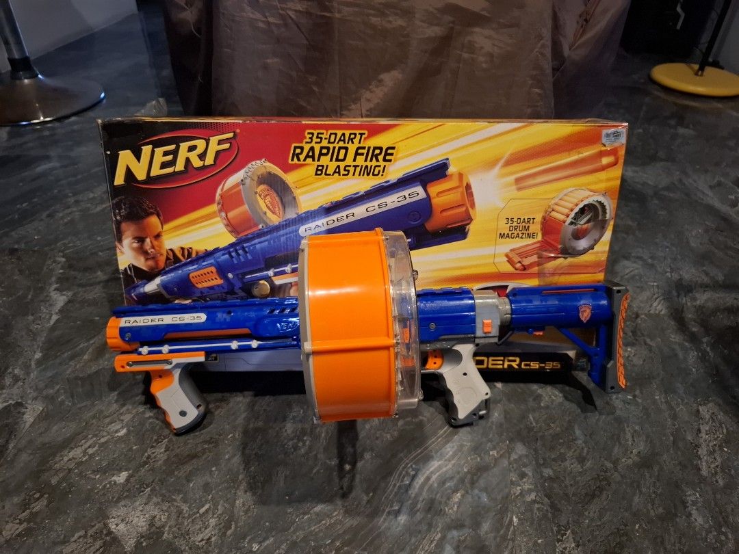 Nerf N-Strike Raider CS-35 Blaster with Drum Magazine (Category: Action & Battle Toys) located in Binan City. Submitted by declutteringmomsh27 (Listing ID 1466892084, Image 1). Description: - Model: Nerf Raider CS-35 (Blue & Orange) - Condition: Working well, great for collection or play - Includes: Massive 35-dart drum magazine and stock - Packaging: Original box included - Features: Rapid-fire action for backyard battles.