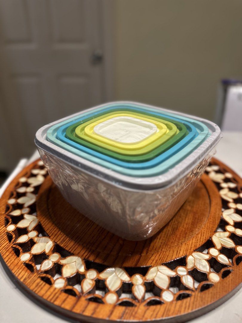 Nested Square Food Storage Containers Multicolored Lids Set (Category: Food Organization & Storage) located in Manila. Submitted by tenshiii185 (Listing ID 1466915090, Image 1). Description: - Space-saving nesting design stores easily inside itself to clear up cabinet space - Clear plastic sides let you instantly see what's inside - Stylish gradient colored lids ranging from white, yellow, green, to blue - Practical square bases for efficient foo