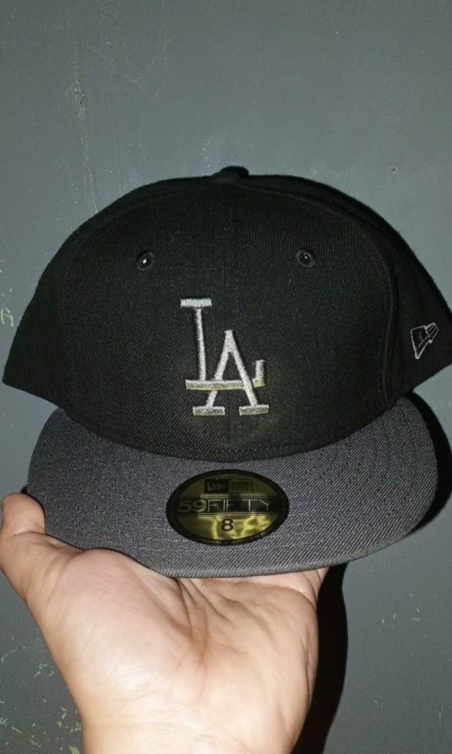 New Era 59FIFTY Los Angeles Dodgers Caps Bundle (Category: Caps & Hats) located in Manila. Submitted by saintruinu58681 (Listing ID 1466810979, Image 3). Description: Set of 2 New Era 59FIFTY fitted hats - Size: 8 - Colors: Blue with white LA logo & Black with red LA logo - Style: Flat brim with gold sticker and structured crown - Details: Clean front embroidery and side New Era flag logo - Condition: Brand new.