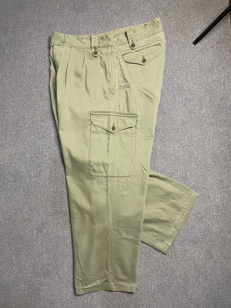 Nigel Cabourn Olive Green Cargo Pants Size 36 (Category: Trousers) located in Quezon City. Submitted by cozy_thrifting (Listing ID 1466805844, Image 3). Description: - Brand: Nigel Cabourn - Style: Cargo Trousers - Color: Olive Green (Herringbone Twill) - Size: Tagged Size 36 - Details: Double pleated front, button fly, suspender buttons on waistband, left side cargo pocket, and rear flap pockets - Material: Heavy-duty cotton with subtle wash thr