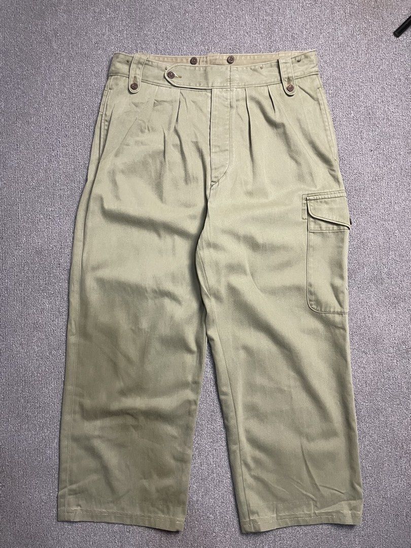 Nigel Cabourn Olive Green Cargo Pants Size 36 (Category: Trousers) located in Quezon City. Submitted by cozy_thrifting (Listing ID 1466805844, Image 1). Description: - Brand: Nigel Cabourn - Style: Cargo Trousers - Color: Olive Green (Herringbone Twill) - Size: Tagged Size 36 - Details: Double pleated front, button fly, suspender buttons on waistband, left side cargo pocket, and rear flap pockets - Material: Heavy-duty cotton with subtle wash thr