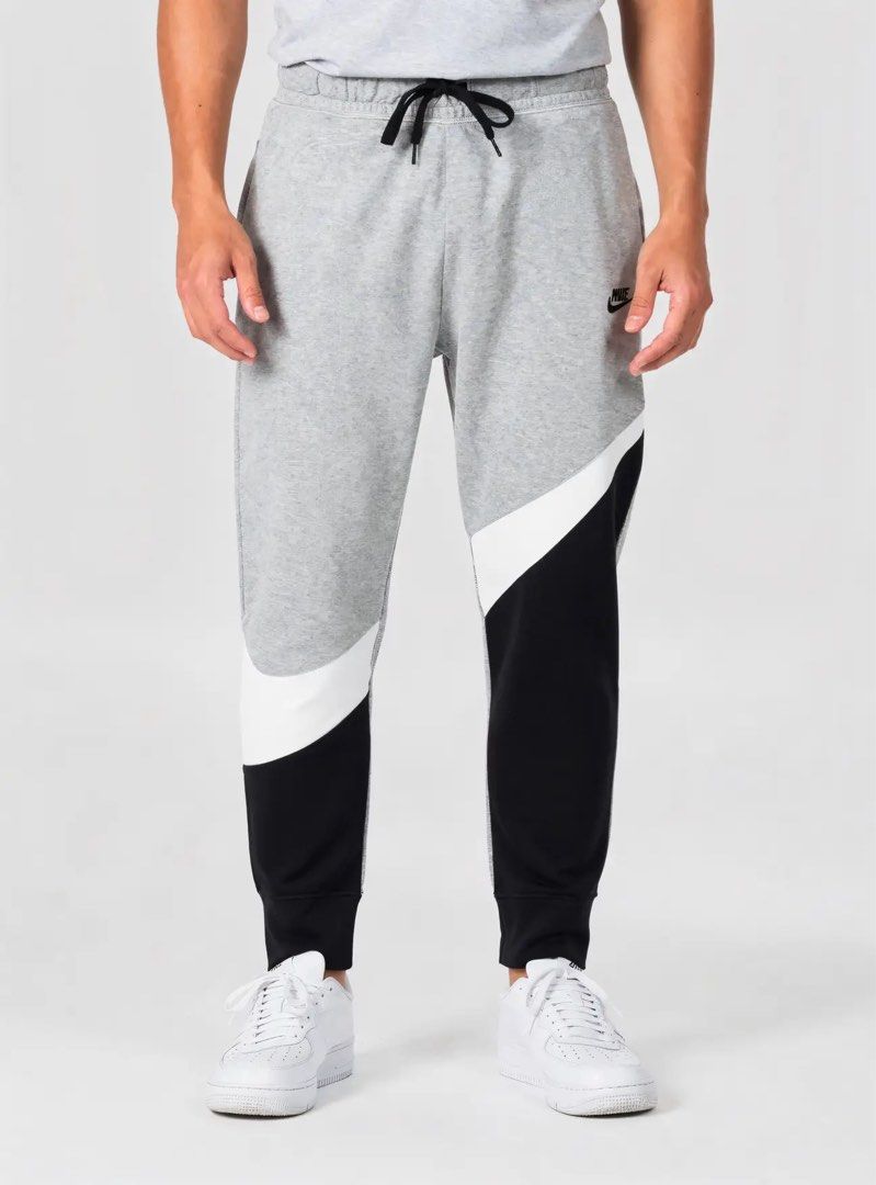 Nike Big Swoosh Jogger Pants (Category: Joggers) located in Cebu City. Submitted by jlturno1999 (Listing ID 1466928024, Image 1). Description: Nike Big Swoosh Jogger Pants Excellent condition 30-36 waistline stretchable, 38.5 length 9.5/10 cr gray, 9/10 cr black Legit/authentic Need wash only.