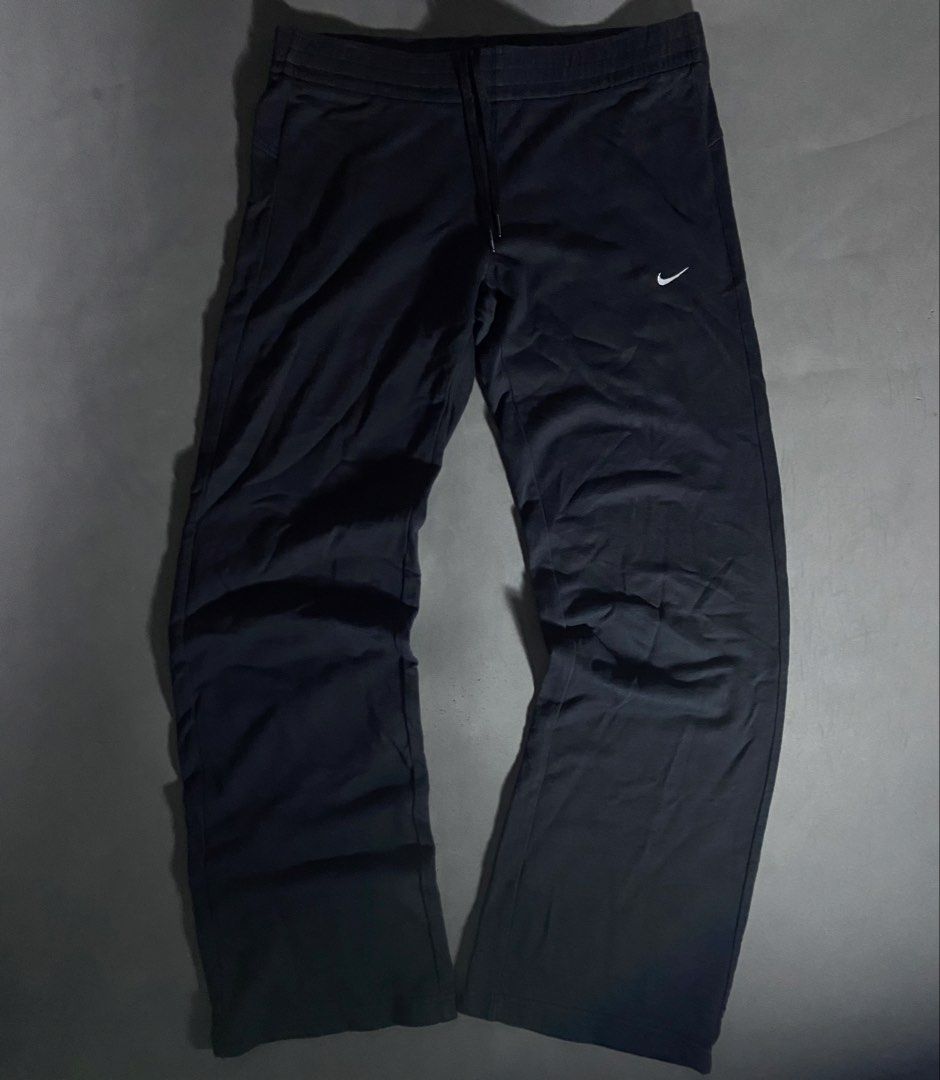 Nike Black Athletic Pants Drawstring Waist Size L (Category: Joggers) located in Manila. Submitted by seccccction80 (Listing ID 1466905499, Image 1). Description: - Authentic Nike athletic pants in classic black - 100% premium cotton for ultimate comfort - Size: Large (L) - Elastic waistband with adjustable drawstring - Embroidered white Nike swoosh logo on left thigh - Relaxed open hem legs - Perfect for gym workouts or everyday casual wear - Ma