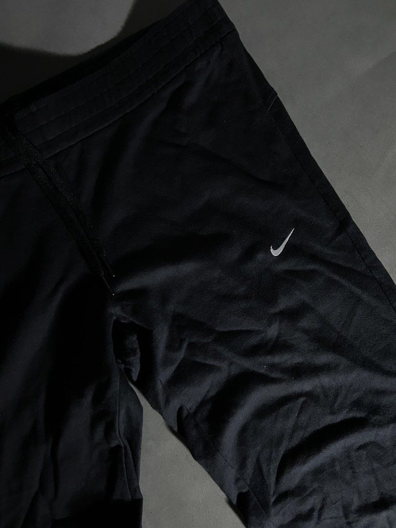 Nike Black Athletic Pants Drawstring Waist Size L (Category: Joggers) located in Manila. Submitted by seccccction80 (Listing ID 1466905499, Image 2). Description: - Authentic Nike athletic pants in classic black - 100% premium cotton for ultimate comfort - Size: Large (L) - Elastic waistband with adjustable drawstring - Embroidered white Nike swoosh logo on left thigh - Relaxed open hem legs - Perfect for gym workouts or everyday casual wear - Ma