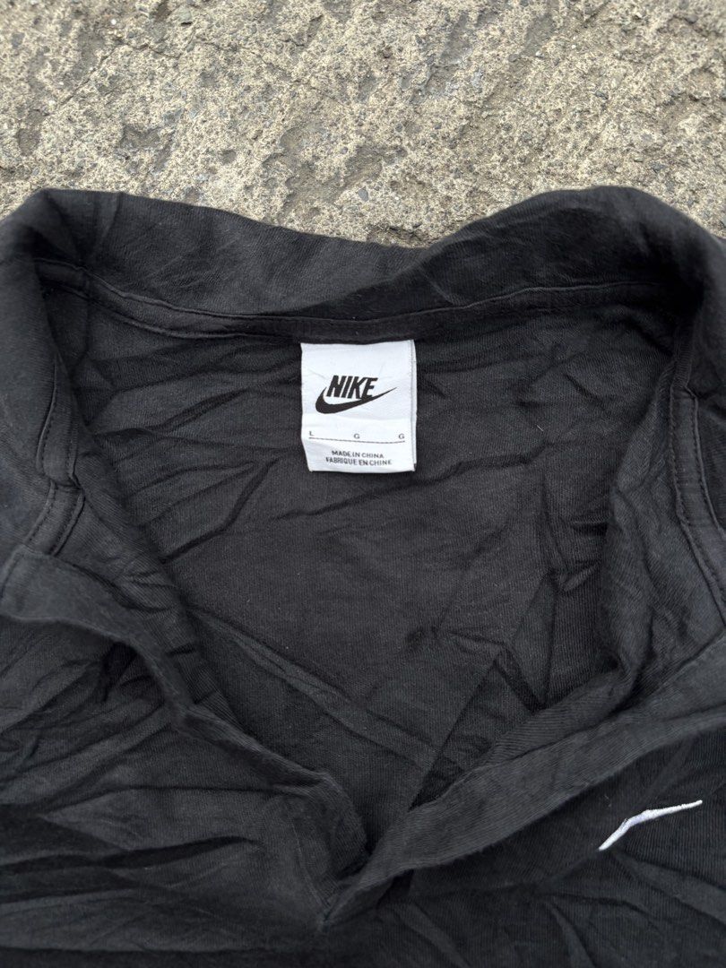 Nike Black Polo Shirt Size L (Category: Tshirts & Polo Shirts ) located in Iligan City. Submitted by seddicmoti2002 (Listing ID 1466865566, Image 3). Description: - Brand: Nike - Color: Black - Size: L (Standard Fit) - Material: Comfortable cotton blend - Design: Short sleeves, collared neckline with V-cut placket - Branding: White embroidered Nike swoosh logo on the left chest - Authenticity: Style code DV7885-010 (Made in China) - Condition: Br