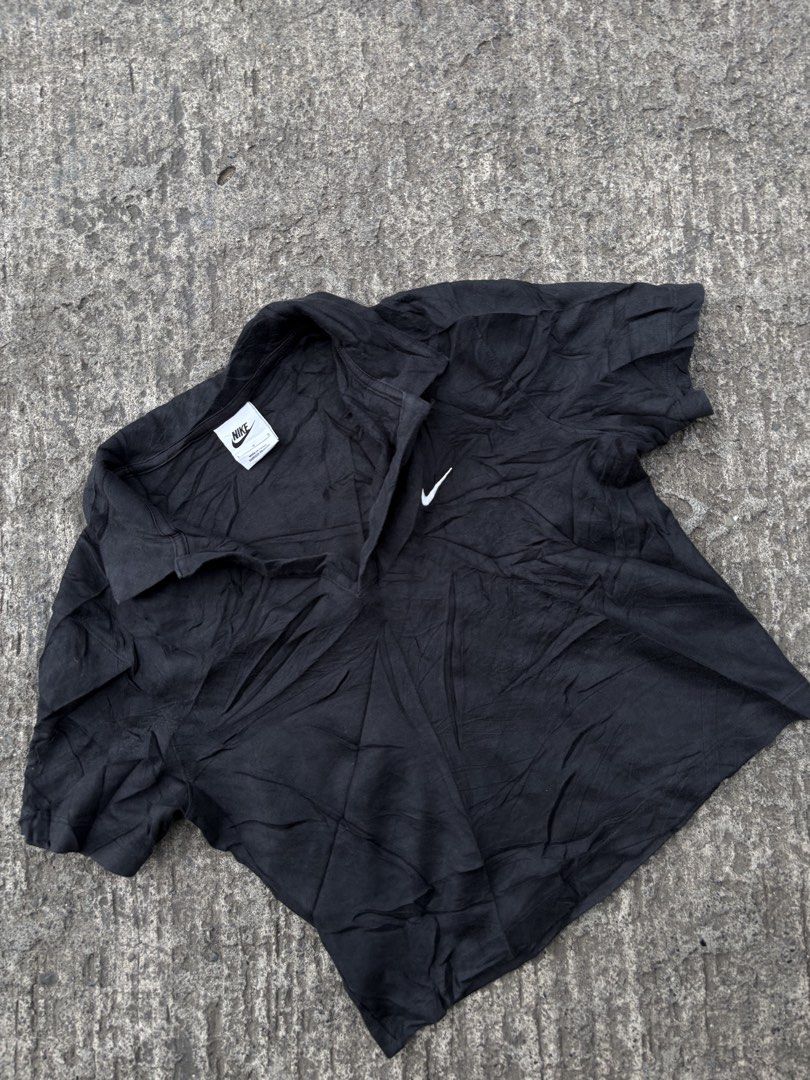 Nike Black Polo Shirt Size L (Category: Tshirts & Polo Shirts ) located in Iligan City. Submitted by seddicmoti2002 (Listing ID 1466865566, Image 2). Description: - Brand: Nike - Color: Black - Size: L (Standard Fit) - Material: Comfortable cotton blend - Design: Short sleeves, collared neckline with V-cut placket - Branding: White embroidered Nike swoosh logo on the left chest - Authenticity: Style code DV7885-010 (Made in China) - Condition: Br