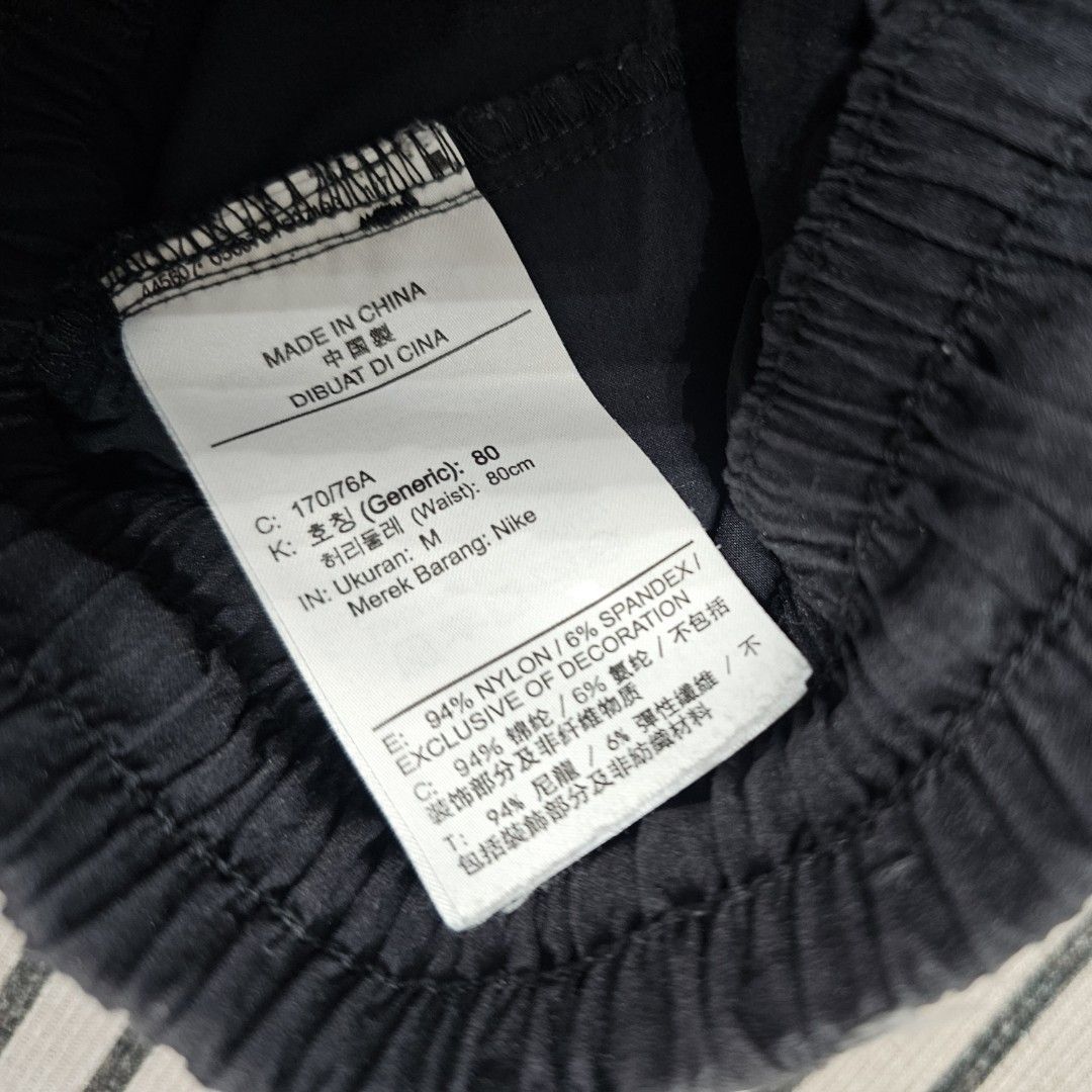 Nike black Shorts (Category: Shorts) located in Baguio. Submitted by kayeonlineshop (Listing ID 1466876560, Image 3). Description: black Nike Sportswear Modern Essentials Unlined Woven Shorts (style code CZ9839-010) featuring a zippered cargo pocket on the right leg and the Nike logo on the left leg w26-38l17.5h12.