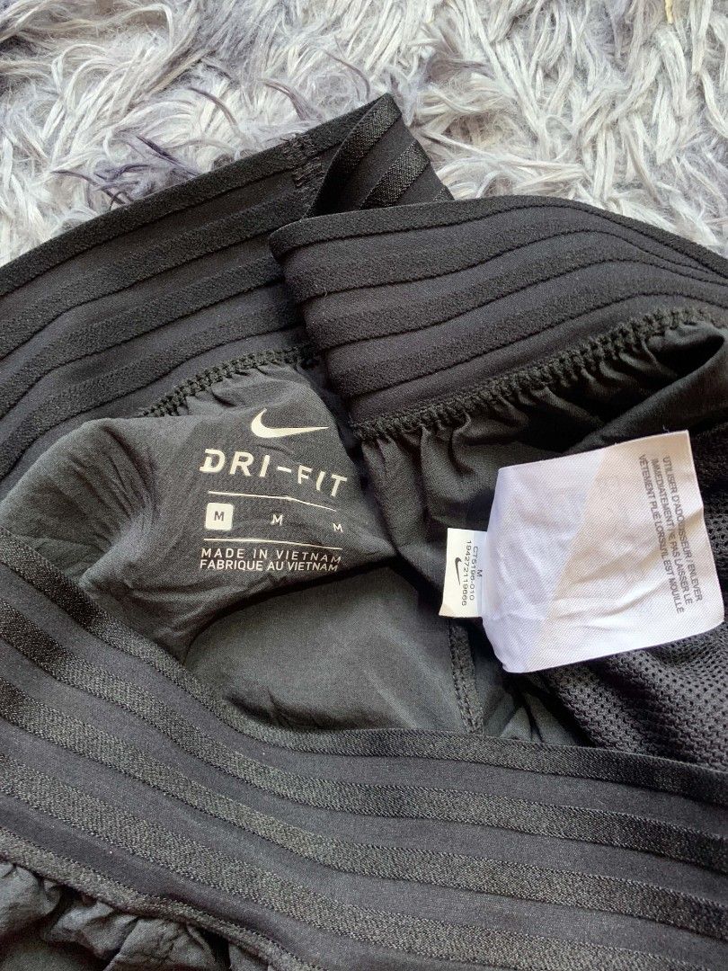 Nike Dri-FIT Black Athletic Shorts Size M (Category: Shorts) located in Pagadian. Submitted by duskthrift (Listing ID 1466855928, Image 2). Description: - Brand: Nike - Item: Dri-FIT Athletic Shorts - Color: Black with white swoosh logo on left leg - Size: Medium (M) - Material: Lightweight, sweat-wicking fabric - Features: Wide ribbed waistband for extra comfort - Condition: Great for workouts, running, and casual wear - Origin: Made in Vietnam 