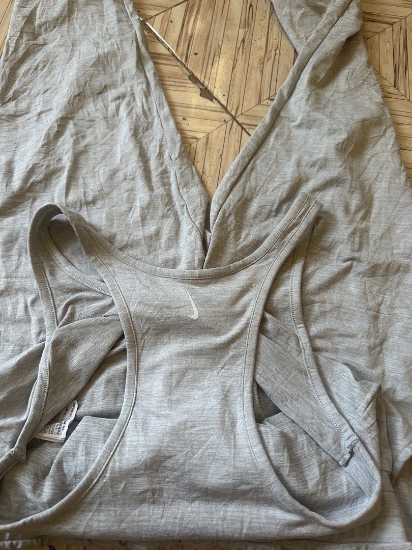 Nike Dri-Fit Grey Athletic Jumpsuit Romper Size M (Category: Jumpsuits) located in Angeles City. Submitted by alejeong27 (Listing ID 1466806830, Image 3). Description: - Brand: Nike - Style: Athletic Dri-Fit Jumpsuit / Romper - Color: Heather Grey - Size: Medium (tag intact) - Material: 87% Polyester, 13% Spandex (soft & stretchy) - Top: Tank style with racerback design - Bottoms: Tapered jogger pants with ribbed cuffs and side pockets - Conditio