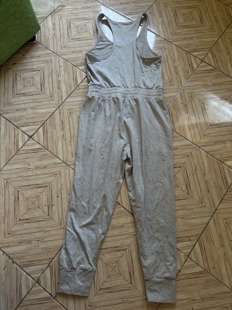 Nike Dri-Fit Grey Athletic Jumpsuit Romper Size M (Category: Jumpsuits) located in Angeles City. Submitted by alejeong27 (Listing ID 1466806830, Image 2). Description: - Brand: Nike - Style: Athletic Dri-Fit Jumpsuit / Romper - Color: Heather Grey - Size: Medium (tag intact) - Material: 87% Polyester, 13% Spandex (soft & stretchy) - Top: Tank style with racerback design - Bottoms: Tapered jogger pants with ribbed cuffs and side pockets - Conditio