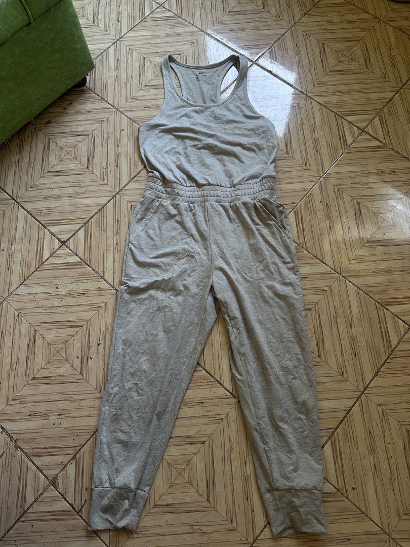 Nike Dri-Fit Grey Athletic Jumpsuit Romper Size M (Category: Jumpsuits) located in Angeles City. Submitted by alejeong27 (Listing ID 1466806830, Image 1). Description: - Brand: Nike - Style: Athletic Dri-Fit Jumpsuit / Romper - Color: Heather Grey - Size: Medium (tag intact) - Material: 87% Polyester, 13% Spandex (soft & stretchy) - Top: Tank style with racerback design - Bottoms: Tapered jogger pants with ribbed cuffs and side pockets - Conditio