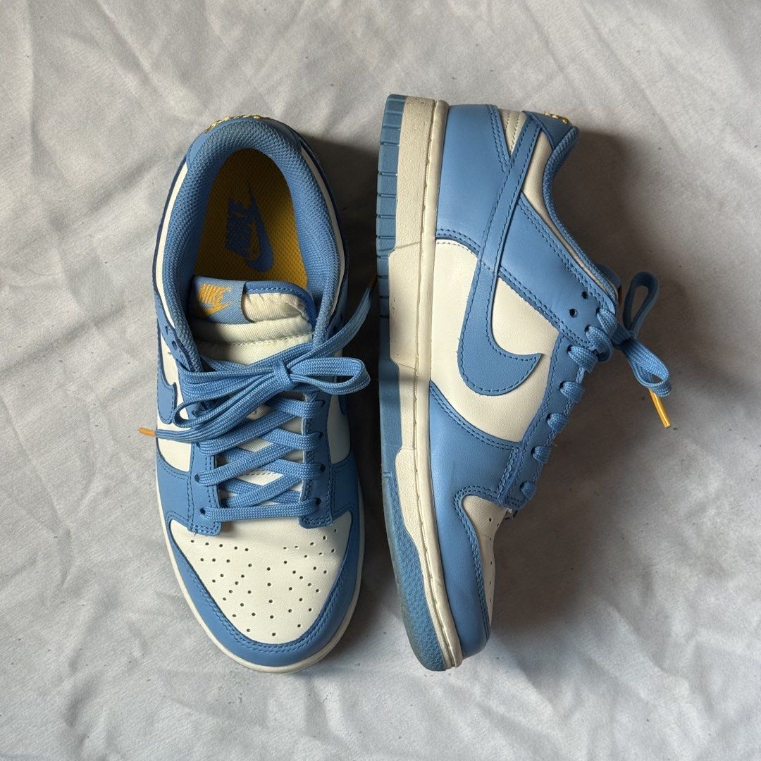 Nike Dunk Low (Category: Sneakers) located in Daet. Submitted by matchapompom (Listing ID 1466860165, Image 2). Description: -Colorway: Sail/Coast University Gold - Condition: Looks new, soles are still very clean - Inclusion: Blue laces included, with box.