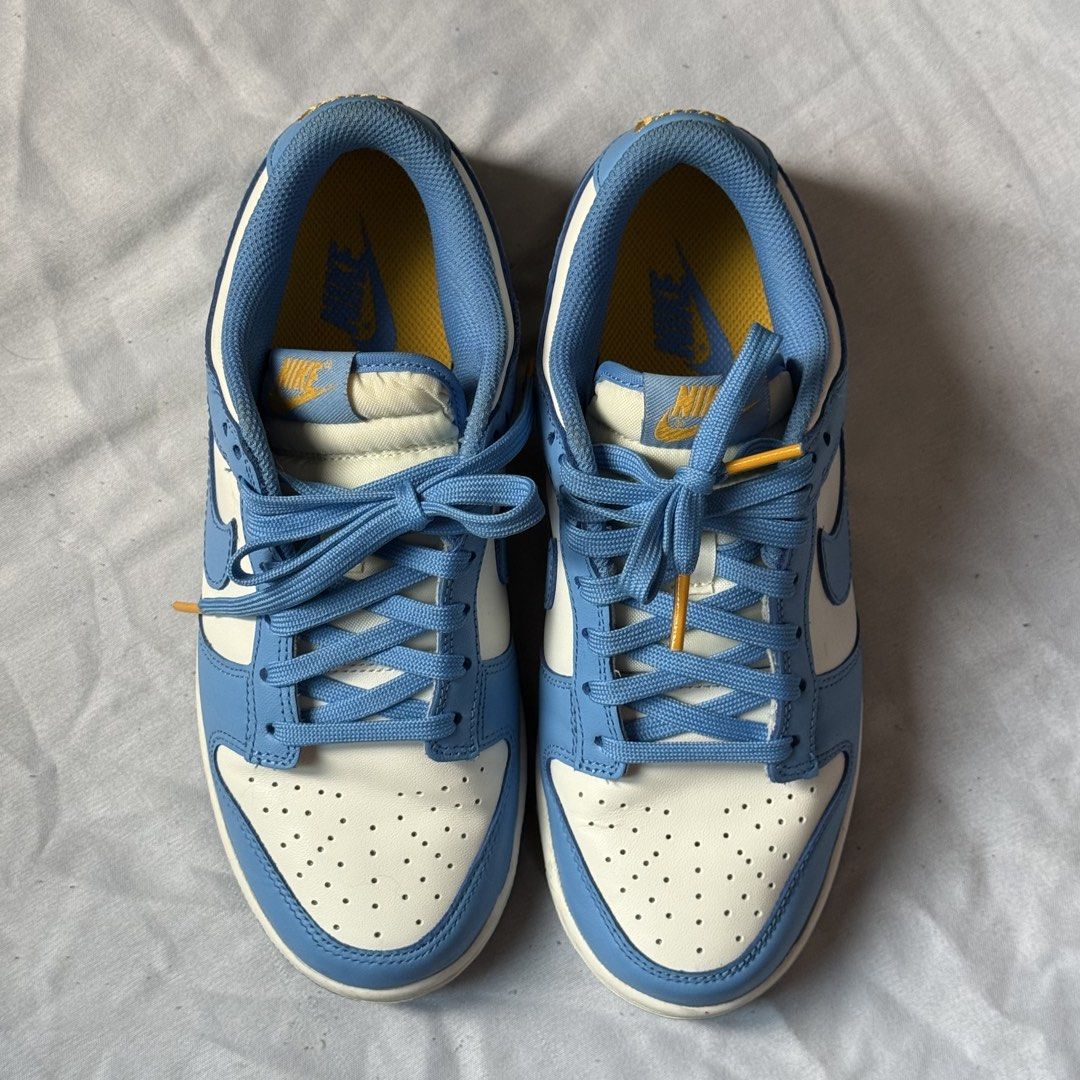 Nike Dunk Low (Category: Sneakers) located in Daet. Submitted by matchapompom (Listing ID 1466860165, Image 1). Description: -Colorway: Sail/Coast University Gold - Condition: Looks new, soles are still very clean - Inclusion: Blue laces included, with box.