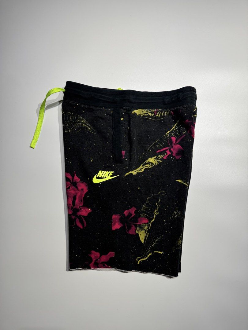 Nike Floral Print Drawstring Shorts Black Size S (Category: Shorts) located in Cavite. Submitted by dracokidstuff (Listing ID 1466838267, Image 3). Description: - Brand: Nike - Size: Small - Color/Pattern: Black with all-over pink and yellow floral print - Details: Neon green drawstring, matching neon Nike swoosh on left leg, trendy raw edge hem - Pockets: Convenient side pockets and one back pocket - Material: Soft cotton, rayon, and polyester b