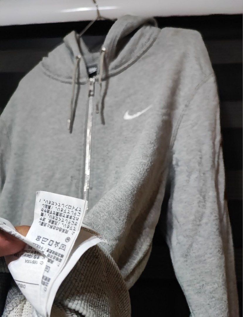 Nike Gray Full Zip Hoodie (Category: Hoodies) located in Pasig City. Submitted by abogadosupremo (Listing ID 1466961116, Image 3). Description: - Color: Gray with white embroidered Nike swoosh on the chest - Closure: Full-zip design with adjustable drawstring hood - Pockets: Two convenient front pockets - Material: Soft and comfortable cotton blend - Fit: Standard fit, ideal for everyday casual wear - THIS IS LEGIT AND ORIGINAL - VERY GOOD CONDIT
