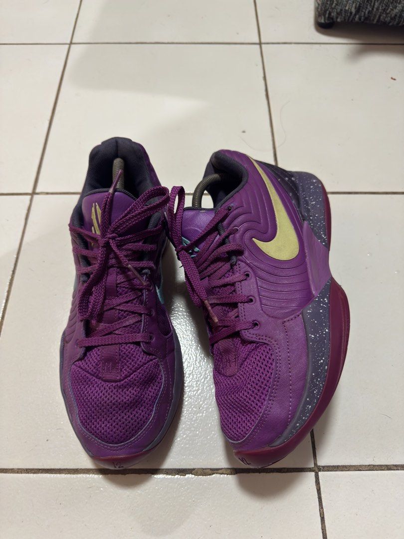 Nike JA 2 Stargazer (Category: Sneakers) located in Manila. Submitted by mislangers_stuff (Listing ID 1466877315, Image 2). Description: - Brand: Nike - Type: Basketball Shoes - Colorway: Purple upper with contrasting teal and yellow-green swooshes - Details: Mesh toe box, white paint splatter midsole, '12:AM' embroidered on heel tabs - Sole: Textured purple rubber outsole with solid grip and lots of tread remaining - Inclusions: Shoes only (no b