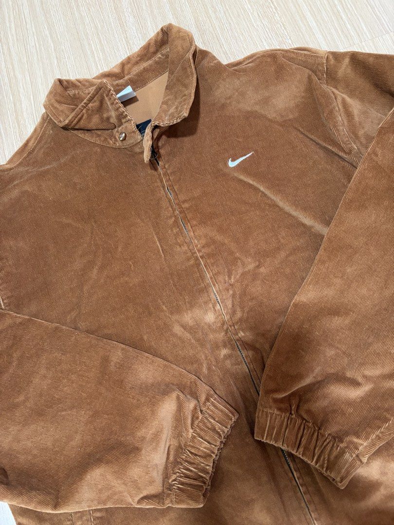 Nike Men Brown Corduroy Zip Jacket (Category: Coats, Jackets and Outerwear) located in Makati City. Submitted by citysunset (Listing ID 1466818903, Image 2). Description: - Brand: Nike - Style: Corduroy zip jacket - Color: Brown - Size: XXL - Details: Classic collar with neck snap button, embroidered white Swoosh on chest, elastic cuffs and hem, two front slash pockets - Origin: Made in Vietnam.