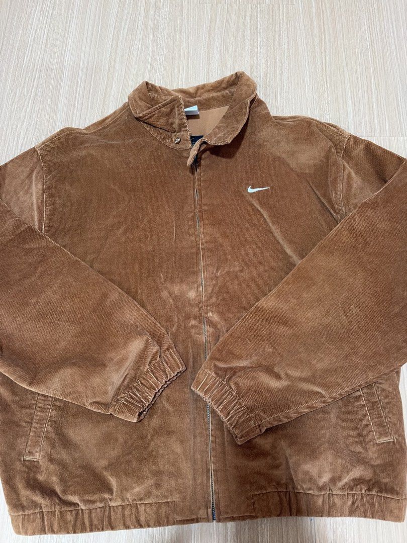 Nike Men Brown Corduroy Zip Jacket (Category: Coats, Jackets and Outerwear) located in Makati City. Submitted by citysunset (Listing ID 1466818903, Image 1). Description: - Brand: Nike - Style: Corduroy zip jacket - Color: Brown - Size: XXL - Details: Classic collar with neck snap button, embroidered white Swoosh on chest, elastic cuffs and hem, two front slash pockets - Origin: Made in Vietnam.