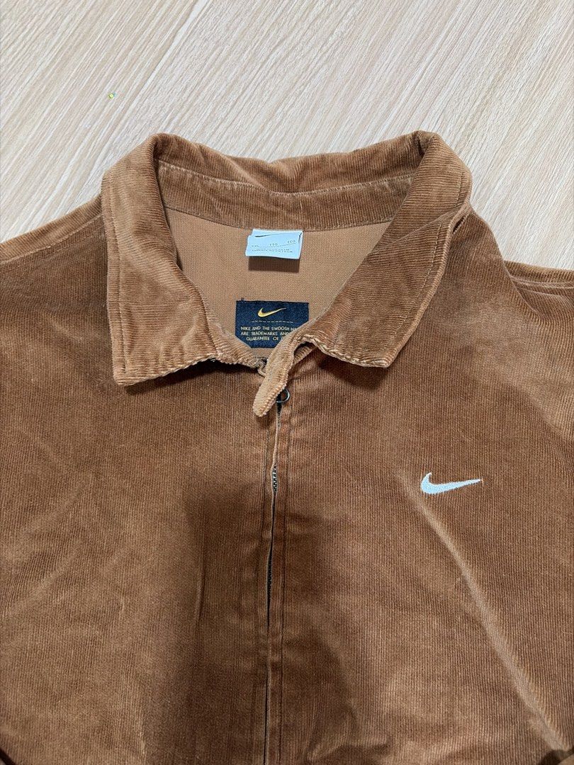 Nike Men Brown Corduroy Zip Jacket (Category: Coats, Jackets and Outerwear) located in Makati City. Submitted by citysunset (Listing ID 1466818903, Image 3). Description: - Brand: Nike - Style: Corduroy zip jacket - Color: Brown - Size: XXL - Details: Classic collar with neck snap button, embroidered white Swoosh on chest, elastic cuffs and hem, two front slash pockets - Origin: Made in Vietnam.