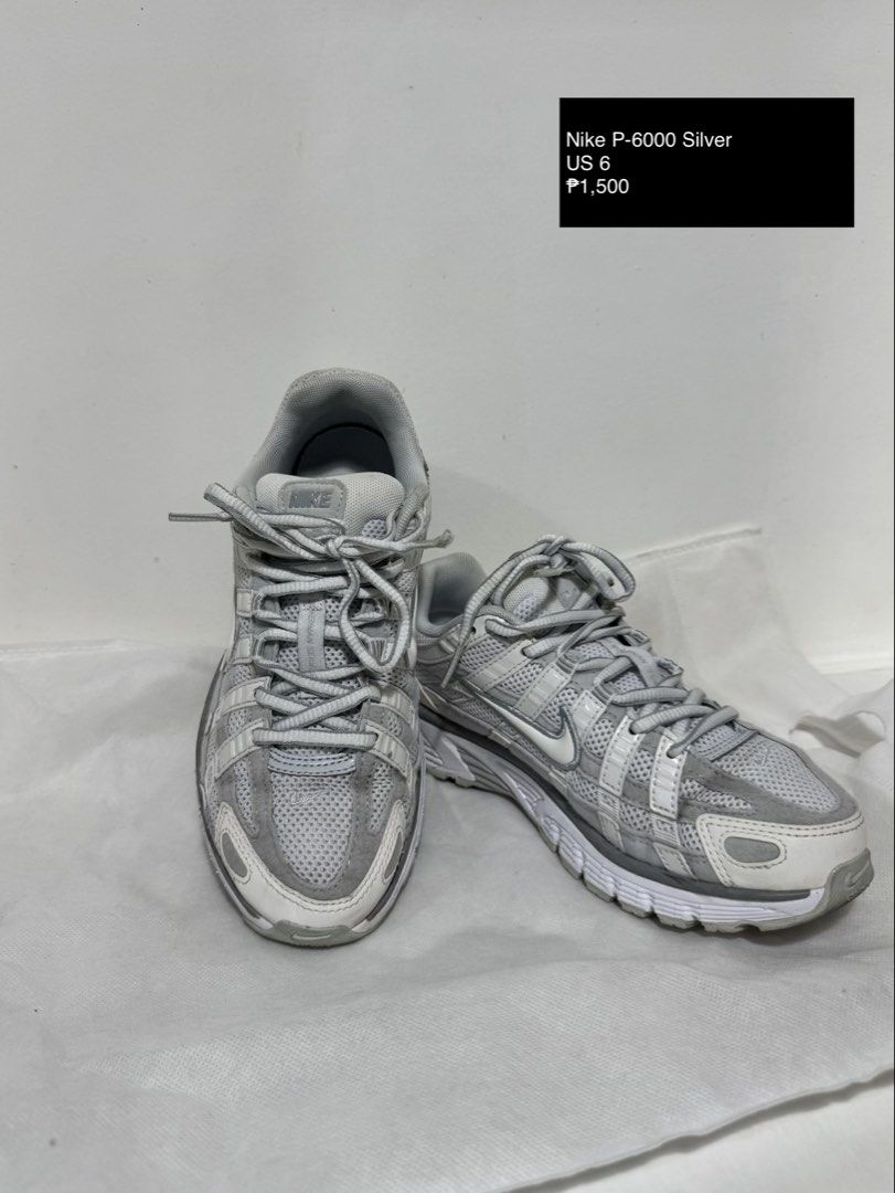 Nike P-6000 Silver US 6 (Category: Sneakers) located in Makati City. Submitted by thrift.plethora (Listing ID 1466800109, Image 1). Description: - Brand: Nike P-6000 - Color: Silver and White - Size: US 6 - Material: Breathable mesh with synthetic leather overlays - Design: Retro chunky sole with striped details - Condition: Clean laces and standard branding - Style: Classic retro running shoes.