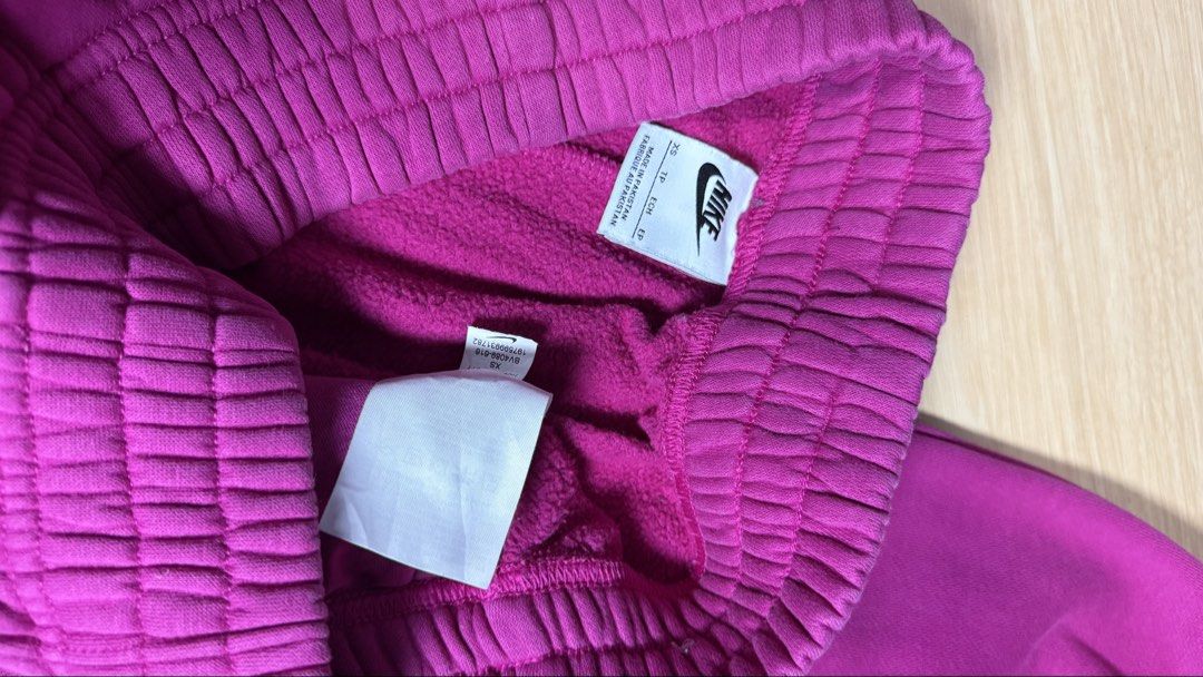 Nike Pink Sweatpants Joggers Size XS (Category: Joggers) located in Baguio. Submitted by zeemoda01 (Listing ID 1466932437, Image 3). Description: Waistline 24-32 - Brand: Nike - Color: Bright pink with white embroidered swoosh - Size: Extra Small (XS) - tag attached - Material & Feel: Super soft fleece lining inside, clean fabric all around - Design: Elastic waistband, ribbed ankle cuffs, and chic front center creases on both legs.