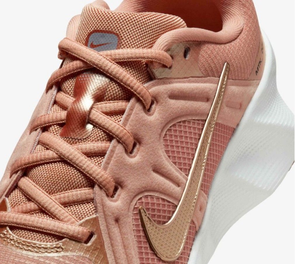 Nike Rose Gold Athletic Sneakers (Category: Sneakers) located in San Jose del Monte. Submitted by Skin_Care2022 (Listing ID 1466798700, Image 1). Description: - Brand/Model: Nike Sneakers - Colorway: Rose gold with metallic gold swoosh and branding - Design: Mesh panels and metallic overlays - Sole: White cushioned midsole with brown patterned rubber outsole - Condition: Clean uppers and pristine soles, ready to wear NEVER NASUOT, BRAND NEW!!! SI