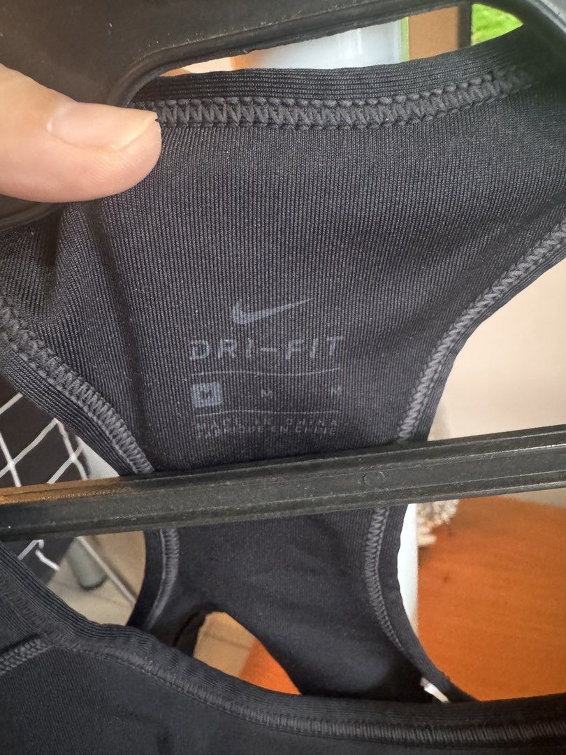 Nike sports bra (Category: Activewear) located in Quezon City. Submitted by essief (Listing ID 1466916016, Image 2). Description: Logo has cracks Built-in pads Overall okay condition .