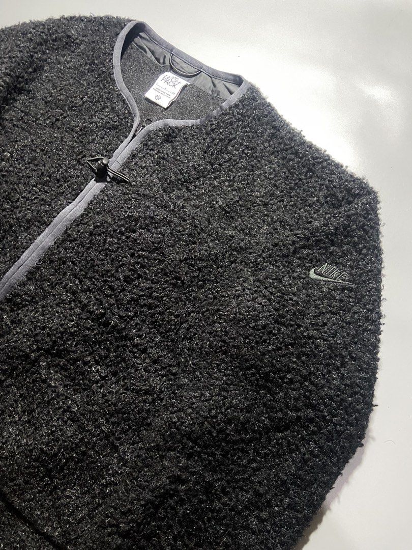Nike Tech Pack Faux Fur Black Jacket Size S (Category: Coats, Jackets and Outerwear) located in Taguig. Submitted by lva.ph (Listing ID 1466860191, Image 2). Description: NIKE TECH PACK SIZE: SMALL W-21 L26 NO ISSUE 9/10 COLOR RATE - Brand: Nike Tech Pack - Style: Funch zip fleece jacket / faux fur - Color: Pitch Black - Size: Small (Regular fit) - Material: 100% Polyester - Features: Dual front pockets, toggle cord accent, tonal embroidered logo