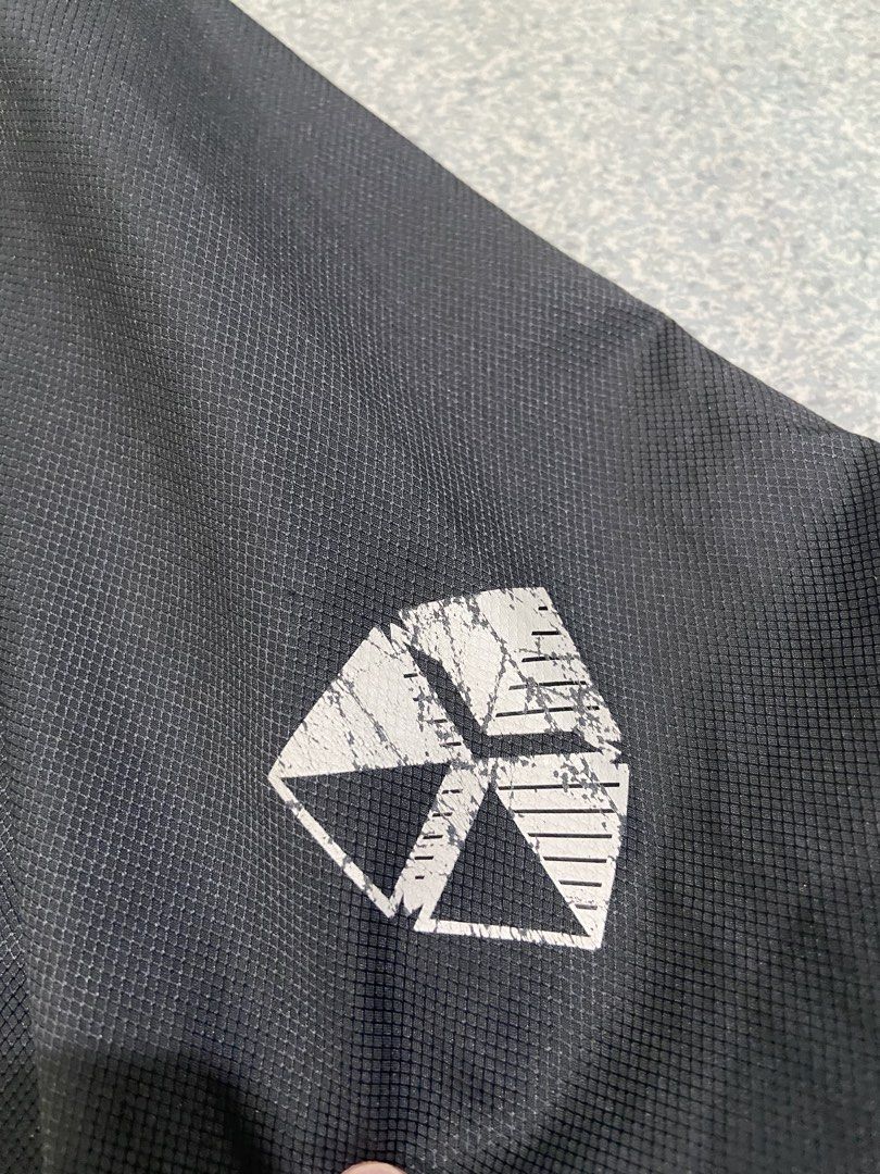 Nike Training Jacket Windbreaker size Medium (Category: Coats, Jackets and Outerwear) located in Baguio. Submitted by chicoroy (Listing ID 1466888571, Image 3). Description: - Brand: Nike - Style: Windbreaker - Color: Black and beige - Size: M (fits chest 95cm, height 165-175cm) Dimes:22/27.5 Issue: crack logo at back and side design - Material: 100% polyester (lightweight) - Features: V-neck collar, ribbed cuffs and hem, sleeve logo detail - Con