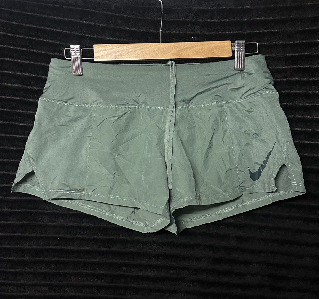 Nike woven running short (Category: Shorts) located in Taguig. Submitted by thriftboy23 (Listing ID 1466792479, Image 1). Description: Good for running For WMNS As new condition No flaws 10/10 Color rate Size M Location: Taguig City.
