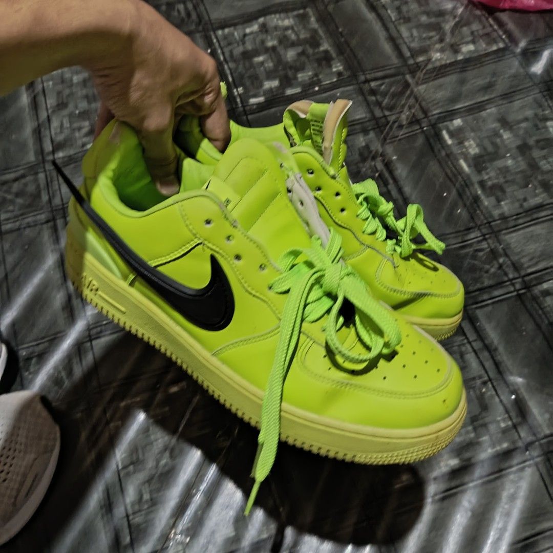 Nike x Ambush(Freebie, purchase any item) (Category: Sneakers) located in Clarin. Submitted by thrftpngsnihan25 (Listing ID 1466919959, Image 1). Description: - Brand: Nike x Ambush - Model: Air Force 1 Low - Colorway: Vibrant Lime Green / Black - Size: US 9.5 / UK 8.5 / EUR 43 - Design: Bold extended swoosh sides - Inclusions: Extra set of camouflage laces included in original box - Condition: Signs of wear on soles and interior collars, ready f