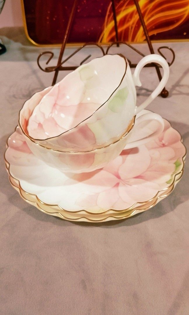 Nikko Pastel teacup sets (Category: Coffee & Tea Tableware) located in Cabanatuan. Submitted by miss.maia (Listing ID 1466962150, Image 2). Description: Brand: Nikko (Japan) Material: Fine Bone China Design: Pastel pink floral motif with scalloped edges and gold-trimmed rims 680 take all +sf.