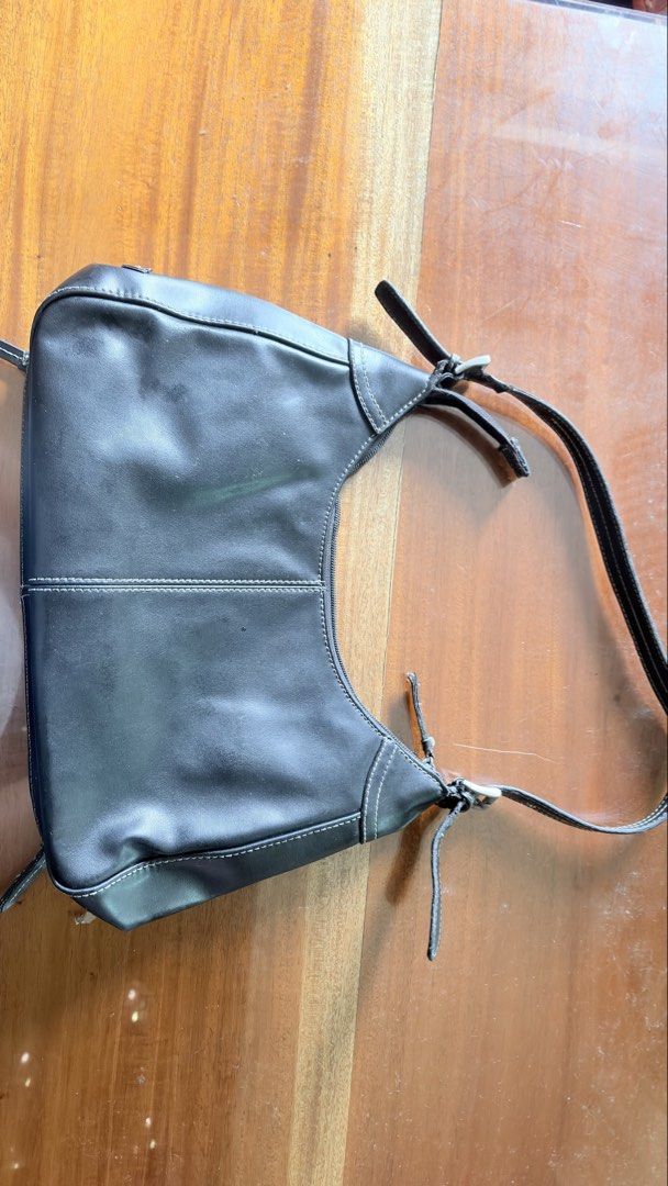 Nine west Black shoulder bag with front zip pocket (Category: Shoulder Bags) located in Manila. Submitted by serraphimav (Listing ID 1466778957, Image 3). Description: - Color & Style: Black shoulder bag with stylish white contrast stitching - Storage: Front flap pocket with zipper closure and secure zip-top main compartment - Design: Adjustable strap with trendy buckle details on both sides - Size: Compact, perfect for everyday use - Condition: 
