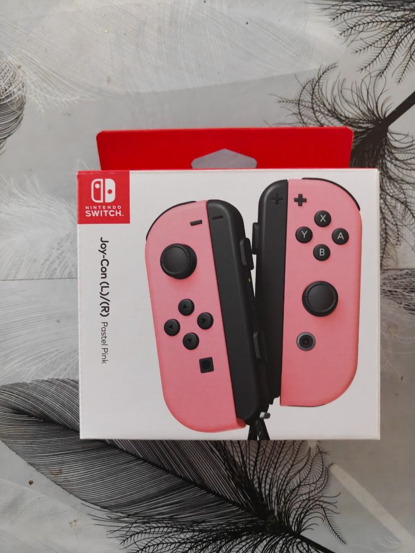 Nintendo Switch Joy-Con Controllers Pink (Category: Controllers) located in Caloocan City. Submitted by oliverval61534 (Listing ID 1466625329, Image 1). Description: - Authentic pink Nintendo Switch Joy-Con controllers (Left & Right set) - Features classic black analog sticks and buttons - Fully functional replacement or spare set for your console - Standard layout with directional, home, and capture buttons - Clean and ready for meetups or shipp