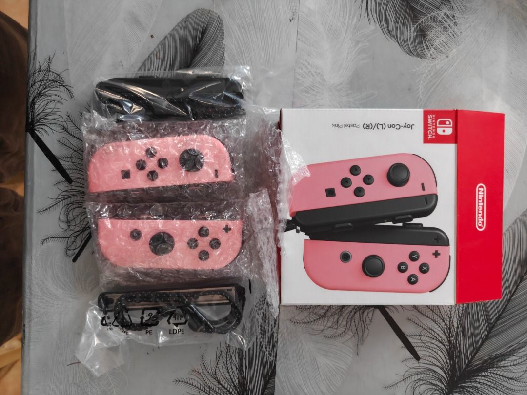 Nintendo Switch Joy-Con Controllers Pink (Category: Controllers) located in Caloocan City. Submitted by oliverval61534 (Listing ID 1466625329, Image 2). Description: - Authentic pink Nintendo Switch Joy-Con controllers (Left & Right set) - Features classic black analog sticks and buttons - Fully functional replacement or spare set for your console - Standard layout with directional, home, and capture buttons - Clean and ready for meetups or shipp