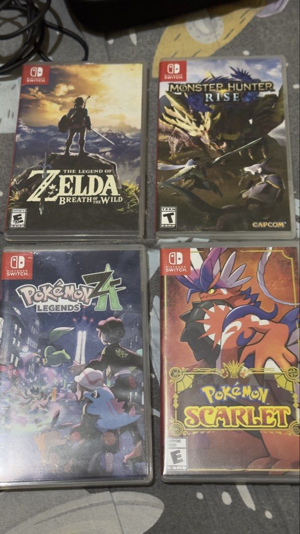 Nintendo Switch OLED Model Bundle with Games and Joy-Cons (Category: Nintendo) located in Plaridel. Submitted by estanislao.noveno (Listing ID 1466858761, Image 3). Description: 🎮 Switch oled Complete package 🎮 *Yung unit and charger lang ang nagamit, the rest all untouched/bnew.* Includes: ✅ Unit (may tempered glass at may silicon case yung orig joycon) ✅ travel/storage bag ✅ AC adapter/charger original ✅ D straps ✅ Hdmi cable ✅ Switch dock ✅ 