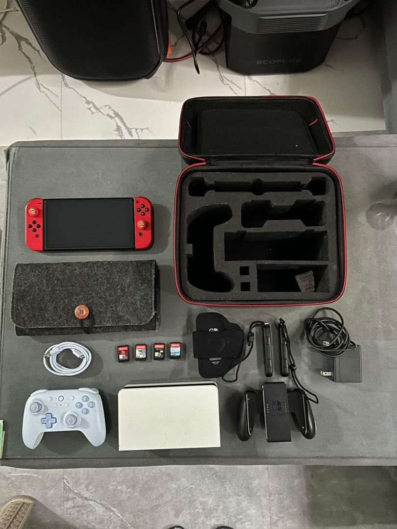 Nintendo Switch OLED Model Console Bundle with Games and Accessories (Category: Nintendo) located in Cavite. Submitted by mightyfalcon_f832f3 (Listing ID 1466969764, Image 2). Description: All in good condition✨ Inclusion: ✅8bitDo controller with own charger cable ✅Nintendo Switch Joy-Con comfort grip ✅Nintendo Switch OLED Model TV Dock ✅Nintendo Switch Joy-Con wrist straps ✅Nintendo Switch Leg Strap ✅Nintendo switch charger ✅felt pouch with Card