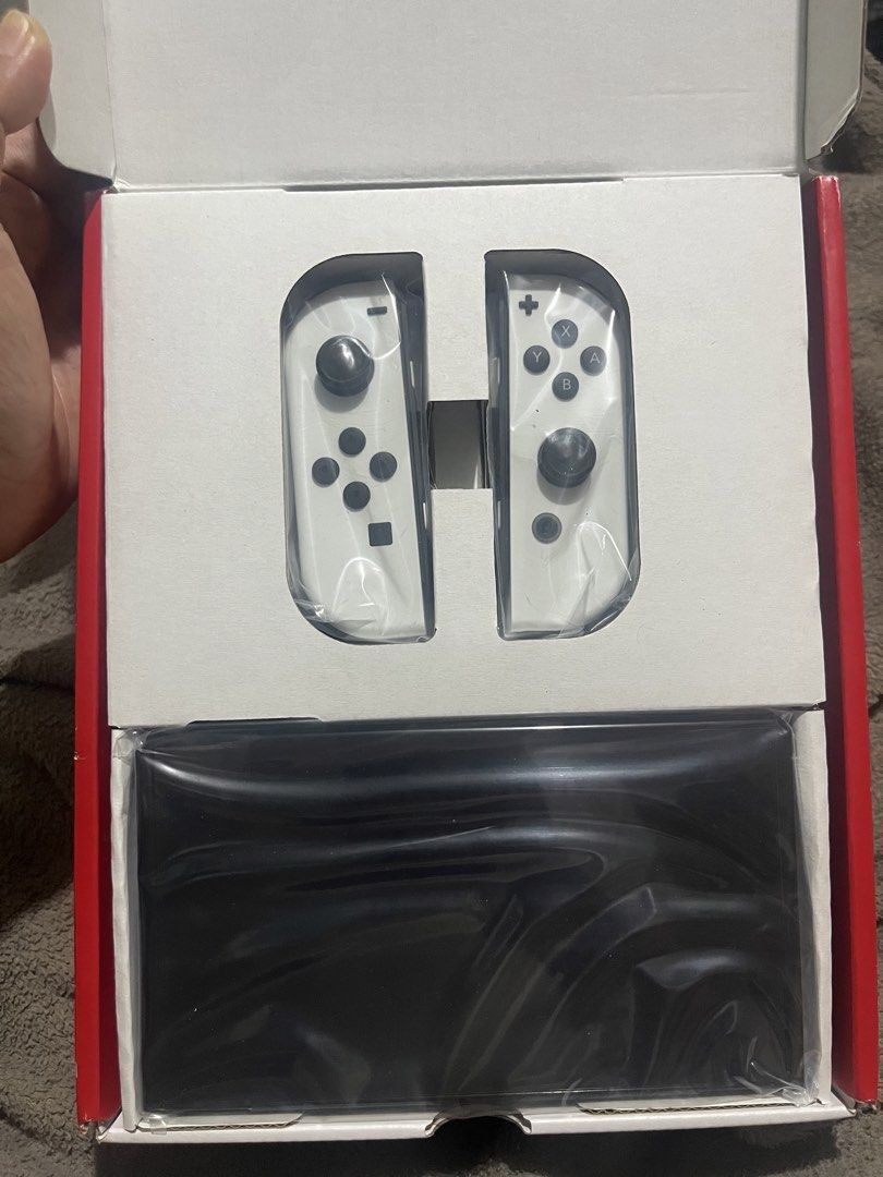 Nintendo Switch OLED Model White (Category: Nintendo) located in Pasig City. Submitted by dexter010283 (Listing ID 1466925274, Image 1). Description: - Brand new Nintendo Switch OLED (White Model) - Includes original box and white Joy-Con controllers - Console and controllers are still factory sealed in plastic - 100% unused and ready for initial setup - Perfect for gifts or personal upgrade.