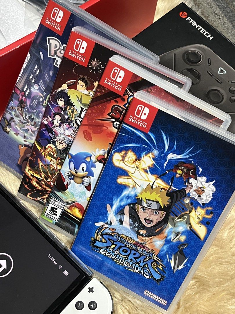 Nintendo Switch OLED White Console with Games and Controller (Category: Nintendo) located in Manila. Submitted by yurimahboy (Listing ID 1466778867, Image 3). Description: - Nintendo Switch OLED White Console - 4 Physical Games: Pokémon Legends, Demon Slayer, Sonic, and Naruto Shippuden - Fantech Shooter III multi-platform gamepad controller - Complete with original box, console packaging, and HDMI cable - All-in-one ready-to-play gaming bundle.