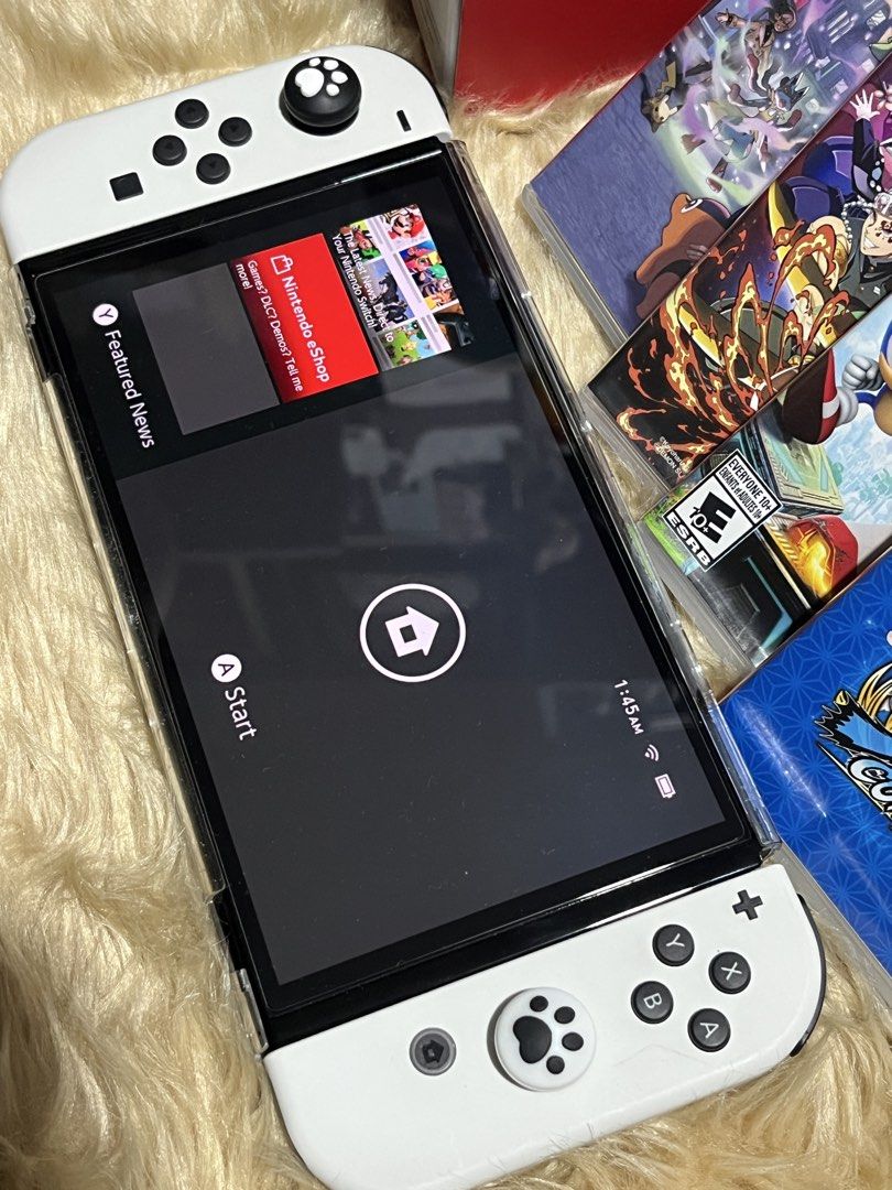 Nintendo Switch OLED White Console with Games and Controller (Category: Nintendo) located in Manila. Submitted by yurimahboy (Listing ID 1466778867, Image 2). Description: - Nintendo Switch OLED White Console - 4 Physical Games: Pokémon Legends, Demon Slayer, Sonic, and Naruto Shippuden - Fantech Shooter III multi-platform gamepad controller - Complete with original box, console packaging, and HDMI cable - All-in-one ready-to-play gaming bundle.