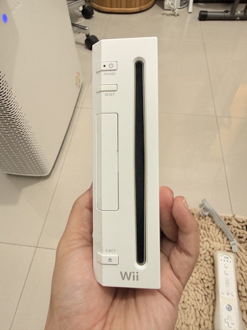 Nintendo Wii Console RVL-001 with Controller and Accessories (Category: Nintendo) located in Quezon City. Submitted by ShopNShip (Listing ID 1466880335, Image 3). Description: Nintendo Wii white console, model RVL-001. Serial number LJF114320377. Includes one remote controller with silicone sleeve and wrist strap. Sensor bar, power supply unit, and Wii2HDMI adapter included. All cords bundled together neatly. Ready for setup and gaming..