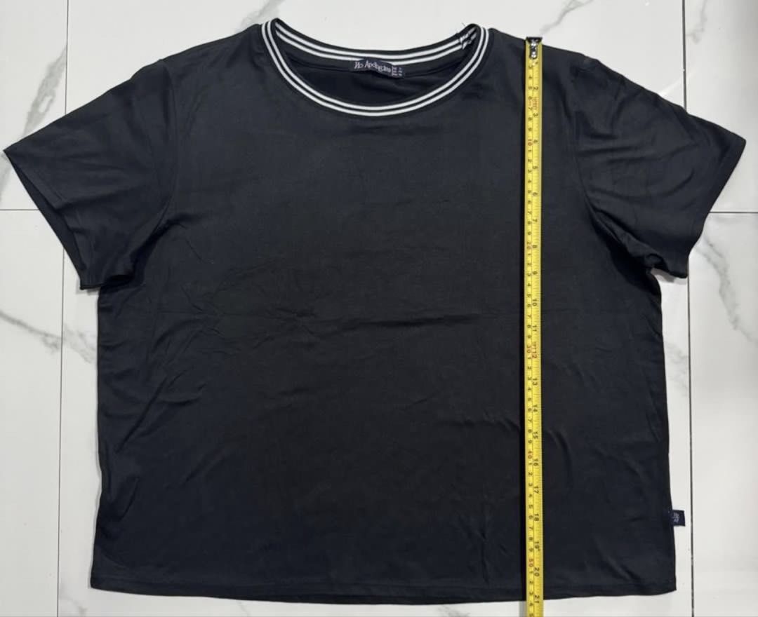 No Apologies Black Striped Collar Tee size L (Category: Blouses) located in Pasay City. Submitted by szepter (Listing ID 1466793885, Image 3). Description: - Brand: No Apologies - Color: Classic black with stylish double white stripes on the round neckline - Sleeves: Short sleeves - Material: Soft and comfortable fabric - Fit/Measurements: Chest width ~23 inches, Length ~21 inches - Condition: Great quality everyday tee.