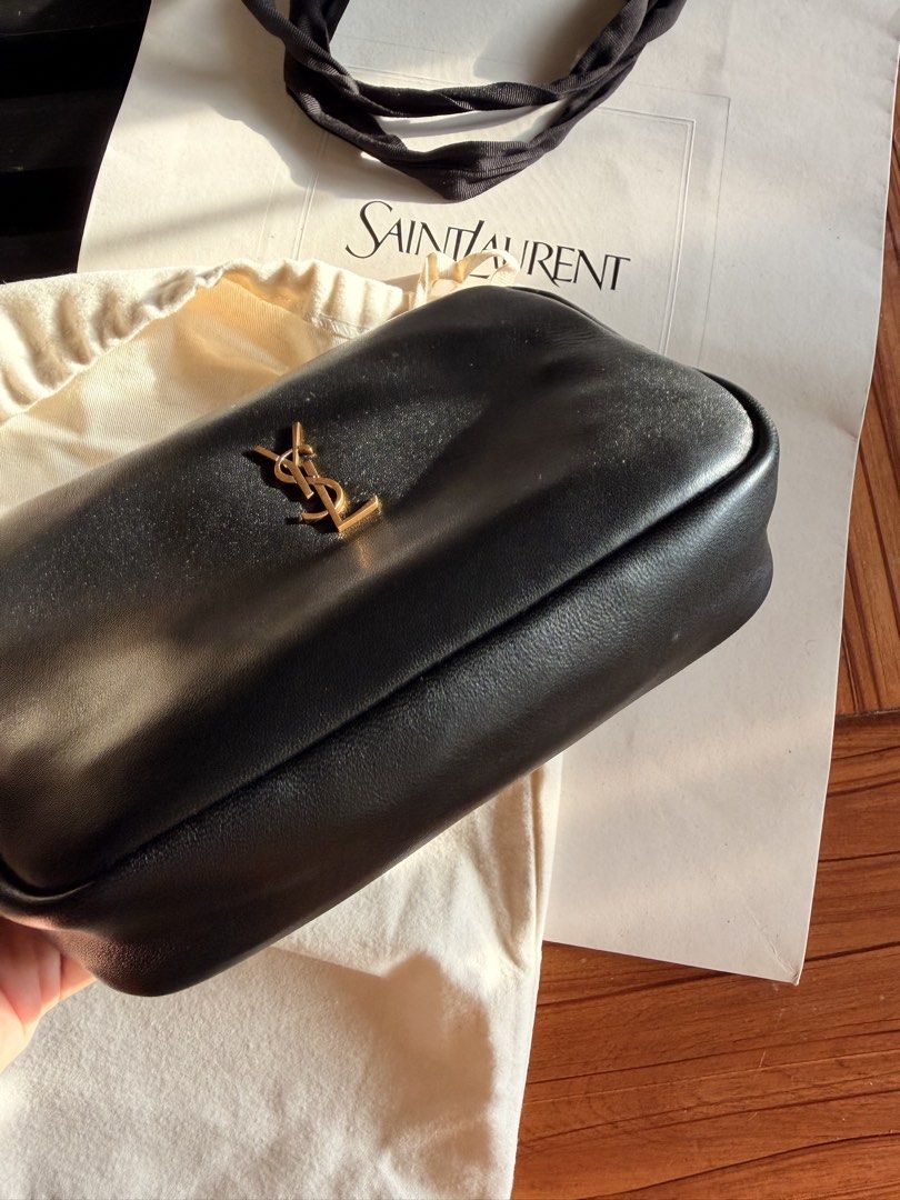 NO INCLUSIONS Saint Laurent Black Leather POUCH (Category: Cross-body Bags) located in Las Pinas. Submitted by twiceloved24 (Listing ID 1466872403, Image 3). Description: - Elegant gold-tone hardware featuring the iconic front YSL logo - Secure zip-top closure with a clean black fabric-lined interior - Built-in interior card slots and Saint Laurent Paris leather tag - Includes original dust bag and shopping bag - Condition: Excellent, well-mainta